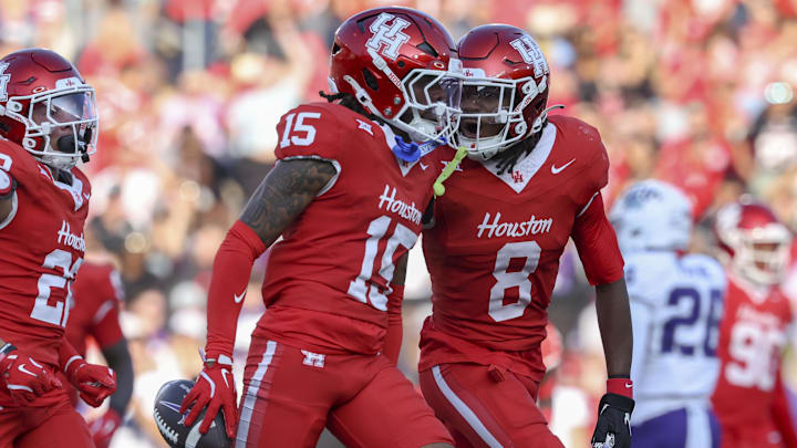 Houston Cougars defensive back Will James (15) celebrates with defensive back Kentrell Webb (8) after an interception during the second quarter against the TCU Horned Frogs at TDECU Stadium. 