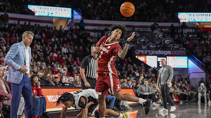 Mar 3, 2026; Athens, Georgia, USA; Alabama Crimson Tide guard Aden Holloway (2) goes after a loose ball over Georgia Bulldogs guard Jeremiah Wilkinson (5) at Stegeman Coliseum. Mandatory Credit: Dale Zanine-Imagn Images