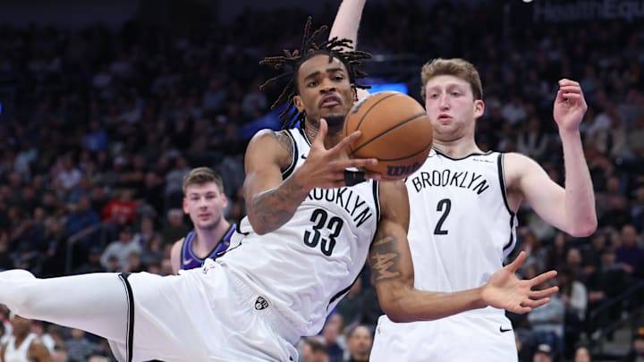 Jan 30, 2026; Salt Lake City, Utah, USA; Brooklyn Nets center Nic Claxton (33) and forward Danny Wolf (2) go for a rebound during the second half against the Utah Jazz at Delta Center. Mandatory Credit: Rob Gray-Imagn Images