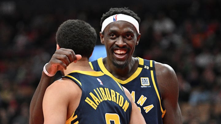 Apr 9, 2024; Toronto, Ontario, CAN; Indiana Pacers guard Tyrese Haliburton (0) is embraced by forward Pascal Siakam (43) after scoring a basket against the Toronto Raptors in the second half at Scotiabank Arena. Mandatory Credit: Dan Hamilton-USA TODAY Sports