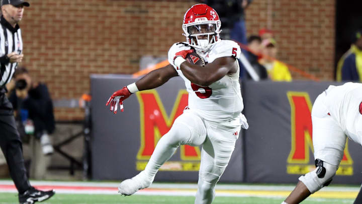 Nov 16, 2024; College Park, Maryland, USA; Rutgers Scarlet Knights running back Kyle Monangai (5) runs for a gain during the first half against the Maryland Terrapins at SECU Stadium. Mandatory Credit: Daniel Kucin Jr.-Imagn Images