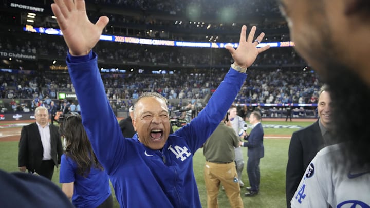 Oct 31, 2025; Toronto, Ontario, CAN; Los Angeles Dodgers manager Dave Roberts (30) celebrates after defeating the Toronto Blue Jays in the 2025 MLB World Series at Rogers Centre. Mandatory Credit: John E. Sokolowski-Imagn Images