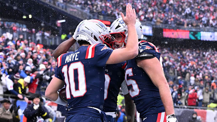 Dec 14, 2025; Foxborough, Massachusetts, USA; New England Patriots quarterback Drake Maye (10) celebrates with tight end Hunter Henry (85) after scoring a touchdown against the Buffalo Bills during the first half at Gillette Stadium. Mandatory Credit: Brian Fluharty-Imagn Images