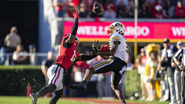Georgia Bulldogs defensive back Julian Humphrey (12) is called for pass interference while covering Missouri Tigers wide receiver Luther Burden III (3)
