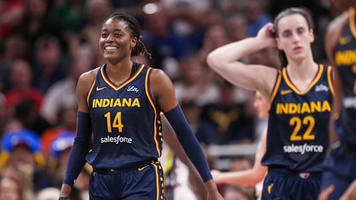 Sep 15, 2024; Indianapolis, Indiana, USA; Indiana Fever center Temi Fagbenle (14) smiles after a foul called on her at Gainbridge Fieldhouse. Mandatory Credit: Grace Hollars/USA TODAY Network via Imagn Images