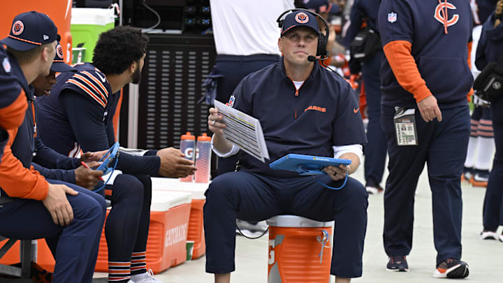 Chicago Bears quarterback Caleb Williams (18) and offensive coordinator Shane Waldron chat during the first half against the Los Angeles Rams at Soldier Field. 