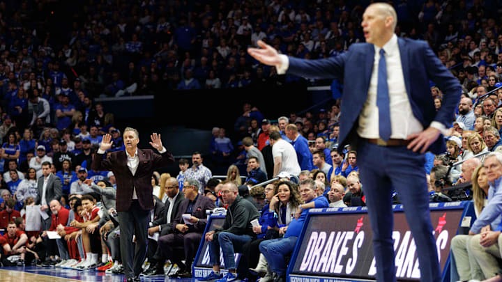 Feb 1, 2025; Lexington, Kentucky, USA; Arkansas Razorbacks head coach John Calipari and Kentucky Wildcats head coach Mark Pope direct their players during the second half at Rupp Arena at Central Bank Center. Mandatory Credit: Jordan Prather-Imagn Images