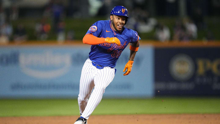 Mar 3, 2025; Port St. Lucie, Florida, USA;  New York Mets outfielder Jose Azocar (30) reaches third base on a fielding error in the sixth inning against the Miami Marlins at Clover Park. Mandatory Credit: Jim Rassol-Imagn Images
