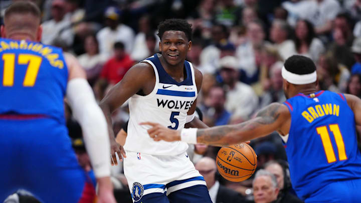 Mar 1, 2026; Denver, Colorado, USA; Minnesota Timberwolves guard Anthony Edwards (5) controls the ball in the second quarter against the Denver Nuggets at Ball Arena.
