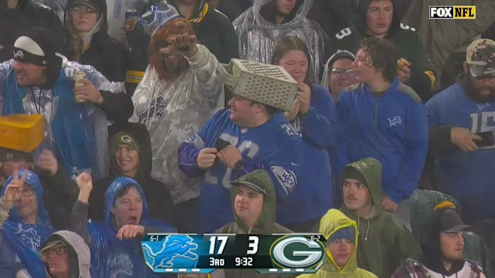 Detroit Lions fan wears a cheese grater hat at Lambeau Field in Week 9 against the Green Bay Packers