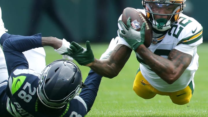 Green Bay Packers wide receiver Matthew Golden (22) catches a pass agains the defense of Seattle Seahawks cornerback Nehemiah Pritchett (28) on Saturday, August 23, 2025, at Lambeau Field in Green Bay, Wis. The Packers defeated the Seahawks 20-7. 