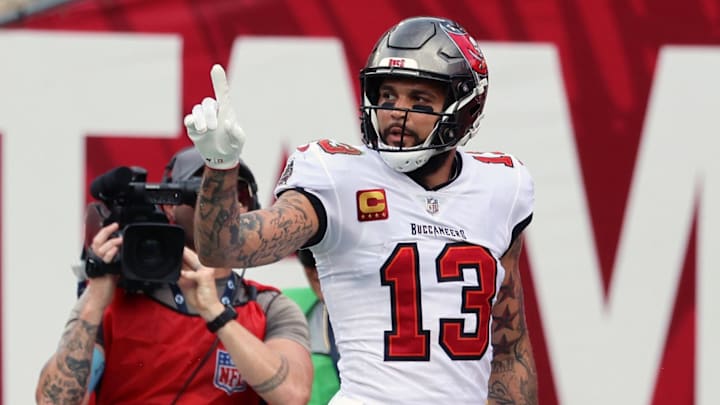 Sep 8, 2024; Tampa, Florida, USA;  Tampa Bay Buccaneers wide receiver Mike Evans (13) catches the ball for a touchdown against the Washington Commanders  during the first half at Raymond James Stadium. Mandatory Credit: Kim Klement Neitzel-Imagn Images