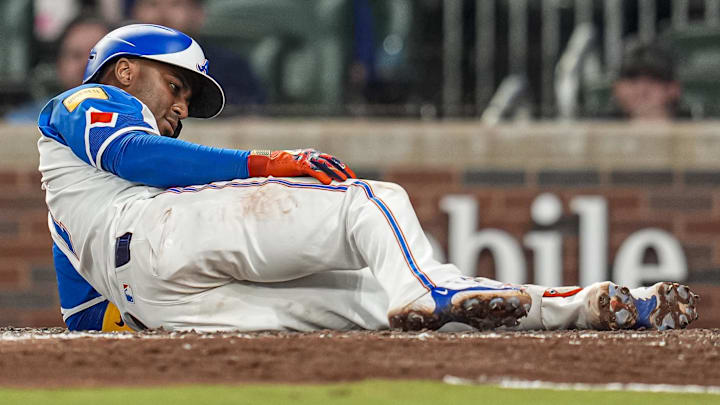 Sep 13, 2025; Cumberland, Georgia, USA; Atlanta Braves second baseman Ozzie Albies (1) reacts after fouling a pitch off his leg against the Houston Astros during the ninth inning at Truist Park.