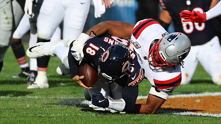 Nov 10, 2024; Chicago, Illinois, USA; New England Patriots defensive end Deatrich Wise Jr. (91) sacks Chicago Bears quarterback Caleb Williams (18) during the second half at Soldier Field. Mandatory Credit: Mike Dinovo-Imagn Images