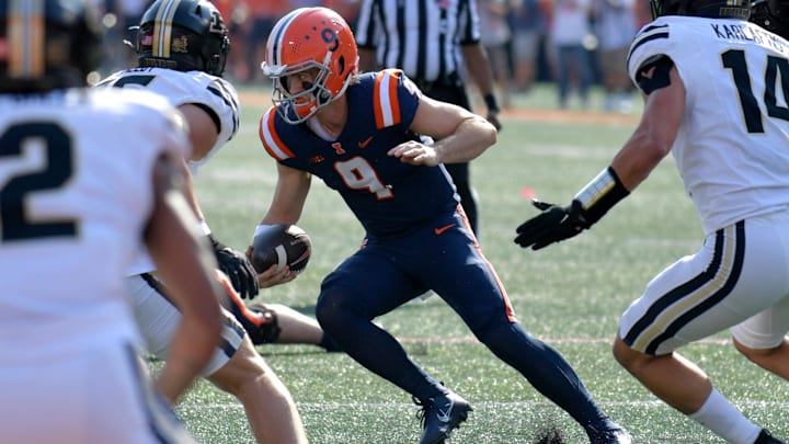 Oct 12, 2024; Champaign, Illinois, USA;  Illinois Fighting Illini quarterback Luke Altmyer (9) runs with the ball in the first half against the Purdue Boilermakers at Memorial Stadium. Mandatory Credit: Ron Johnson-Imagn Images