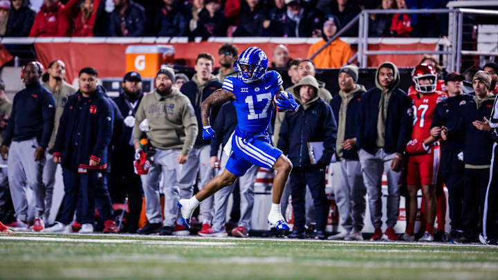 BYU wide receiver Keelan Marion returns a kickoff for a touchdown against Utah