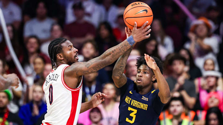 Jan 24, 2026; Tucson, Arizona, USA; Arizona Wildcats guard Jaden Bradley (0) blocks a pass attempted by West Virginia Mountaineers guard Honor Huff (3) during the second half of the game at McKale Memorial Center. Mandatory Credit: Aryanna Frank-Imagn Images Jan 24, 2026; Tucson, Arizona, USA; Arizona Wildcats guard Jaden Bradley (0) blocks a pass attempted by West Virginia Mountaineers guard Honor Huff (3) during the second half of the game at McKale Memorial Center. Mandatory Credit: Aryanna Frank-Imagn Images