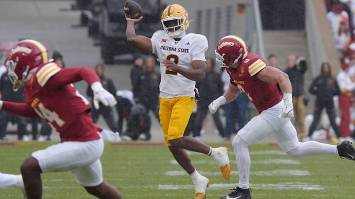 Arizona State Sun Devils quarterback Jeff Sims (2) passes the ball around Iowa State Cyclones' linebacker Cael Brezina (9) during the second quarter in the Big-12 showdown at jack Trice Stadium on Nov. 1, 2025, in Ames, Iowa.