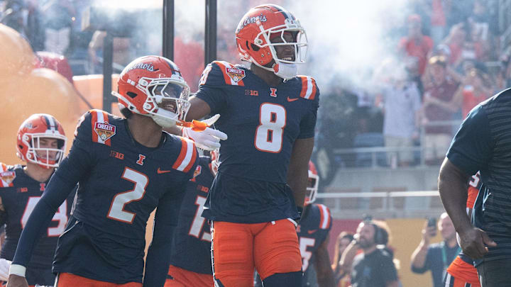 Dec 31, 2024; Orlando, FL, USA; Illinois Fighting Illini wide receiver Malik Elzy (8) and Illinois Fighting Illini wide receiver Ashton Hollins (2) lead the team out of the tunnel before the game against the South Carolina Gamecocks at Camping World Stadium. Mandatory Credit: Jeremy Reper-Imagn Images