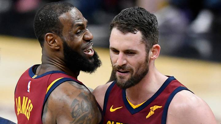 Cleveland Cavaliers center Kevin Love (0) celebrates his three-point basket with forward LeBron James (23) in the fourth quarter against the Toronto Raptors at Quicken Loans Arena. 