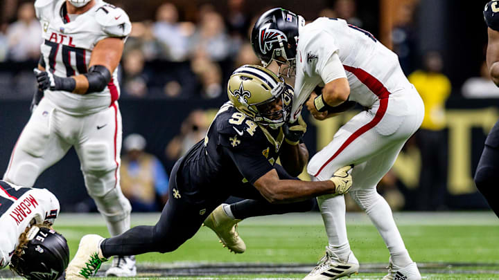New Orleans Saints defensive end Cameron Jordan (94) leaps to sack Atlanta Falcons quarterback Kirk Cousins (18)