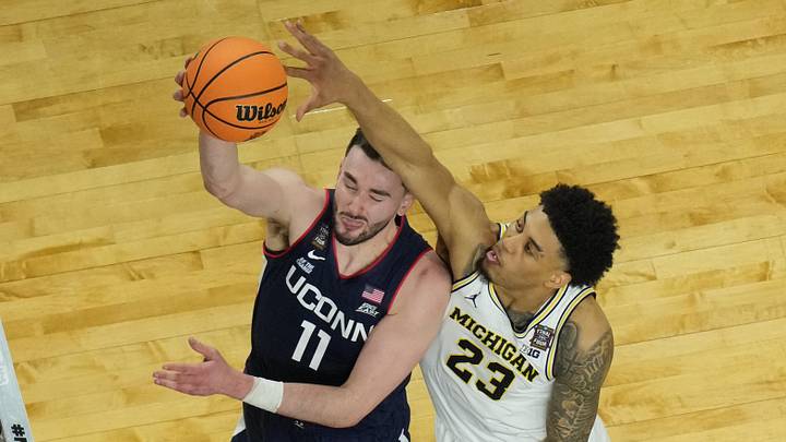 Apr 6, 2026; Indianapolis, IN, USA; Connecticut Huskies forward Alex Karaban (11) shoots against Michigan Wolverines forward Yaxel Lendeborg (23) in the second half during the national championship of the Final Four of the men's 2026 NCAA Tournament at Lucas Oil Stadium. Apr 6, 2026; Indianapolis, IN, USA; Connecticut Huskies forward Alex Karaban (11) shoots against Michigan Wolverines forward Yaxel Lendeborg (23) in the second half during the national championship of the Final Four of the men's 2026 NCAA Tournament at Lucas Oil Stadium.