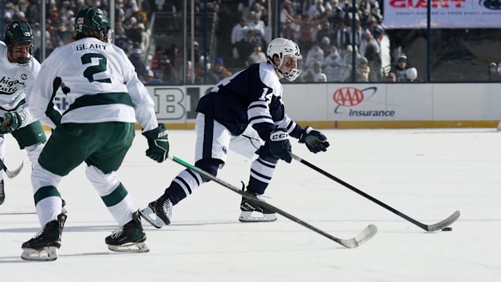 Jan 31, 2026; State College, PA, USA; Penn State Nittany Lions forward Matt DiMarsico (14) moves the puck across the ice during the first period against the Michigan State Spartans at Beaver Stadium. Mandatory Credit: Matthew O'Haren-Imagn Images Jan 31, 2026; State College, PA, USA; Penn State Nittany Lions forward Matt DiMarsico (14) moves the puck across the ice during the first period against the Michigan State Spartans at Beaver Stadium. Mandatory Credit: Matthew O'Haren-Imagn Images