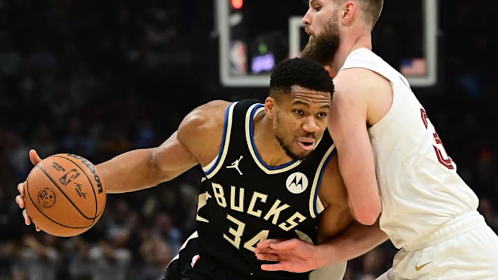 Dec 20, 2024; Cleveland, Ohio, USA; Milwaukee Bucks forward Giannis Antetokounmpo (34) drives to the basket against Cleveland Cavaliers forward Dean Wade (32) during the first quarter at Rocket Mortgage FieldHouse. Mandatory Credit: Ken Blaze-Imagn Images