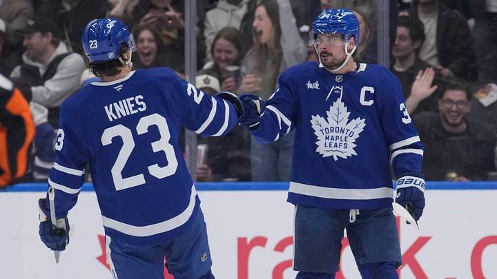 Mar 12, 2026; Toronto, Ontario, CAN; Toronto Maple Leafs forward Matthew Knies (23) congratulates forward Auston Matthews (34) on his goal against the Anaheim Ducks during the second period at Scotiabank Arena. Mandatory Credit: John E. Sokolowski-Imagn Images