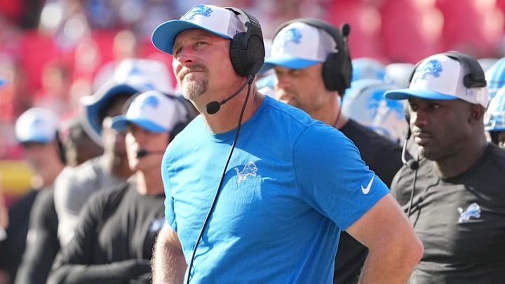 Detroit Lions head coach Dan Campbell watches a replay against the Kansas City Chiefs during the second half at GEHA Field at Arrowhead Stadium.