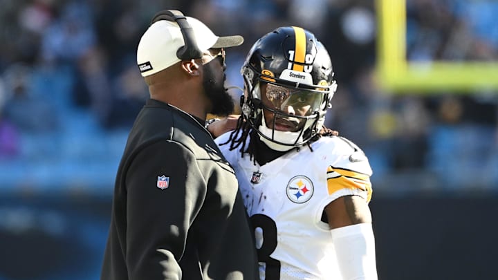 Dec 18, 2022; Charlotte, North Carolina, USA; Pittsburgh Steelers head coach Mike Tomlin talks to wide receiver Diontae Johnson (18) in the third quarter at Bank of America Stadium. Mandatory Credit: Bob Donnan-Imagn Images