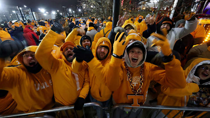 Tennessee Volunteers fans gather to watch the team arrive before the game against the Ohio State Buckeyes at Ohio Stadium. 