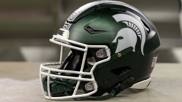 Nov 24, 2023; Detroit, Michigan, USA; A Michigan State Spartans helmet sits on a bench during the second half game against the Penn State Nittany Lions at Ford Field. Mandatory Credit: David Reginek-Imagn Images