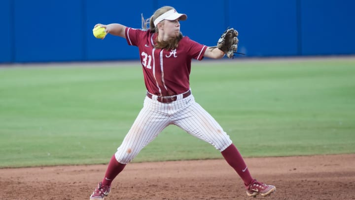 May 31, 2024; Oklahoma City, OK, USA;  Alabama Crimson Tide infielder Kenleigh Cahalan (31) throws to first base in  the sixth inning against the Duke Blue Devils during a Women's College World Series softball losers bracket elimination game at Devon Park. Mandatory Credit: Brett Rojo-USA TODAY Sports