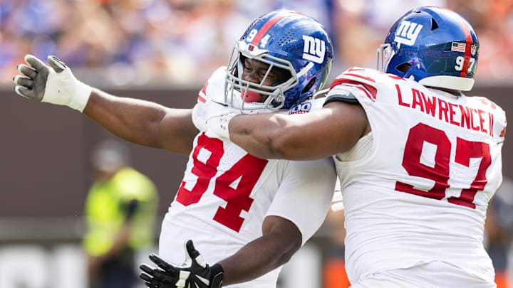 Sep 22, 2024; Cleveland, Ohio, USA; New York Giants defensive tackle Dexter Lawrence II (97) congratulates defensive tackle Elijah Chatman (94) on his sack against the Cleveland Browns during the first quarter at Huntington Bank Field. Mandatory Credit: Scott Galvin-Imagn Images