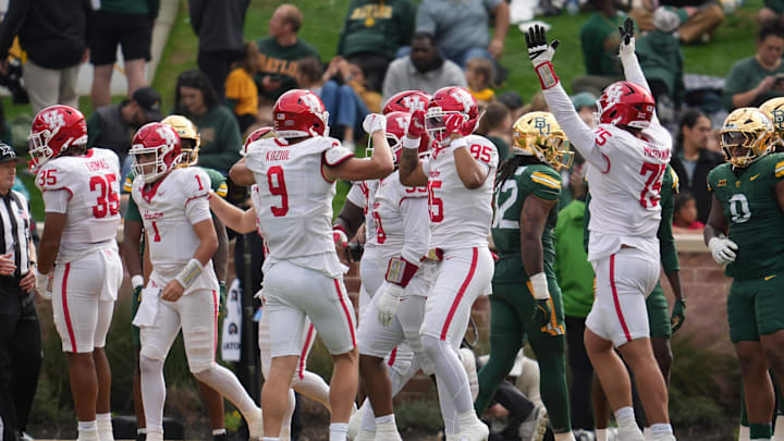 Nov 29, 2025; Waco, Texas, USA; The Houston Cougars celebrate after a play against the Baylor Bears during the second half at McLane Stadium. Mandatory Credit: Chris Jones-Imagn Images