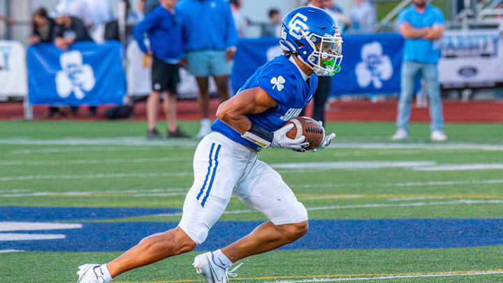 Detroit Catholic Central's Samson Gash returns a punt during a football game on Friday, Aug. 29, 2025.