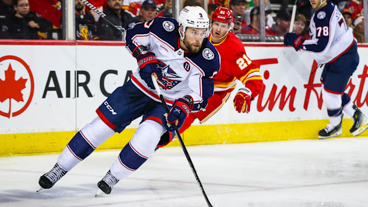Dec 3, 2024; Calgary, Alberta, CAN; Columbus Blue Jackets defenseman Ivan Provorov (9) controls the puck against the Calgary Flames during the second period at Scotiabank Saddledome. Mandatory Credit: Sergei Belski-Imagn Images