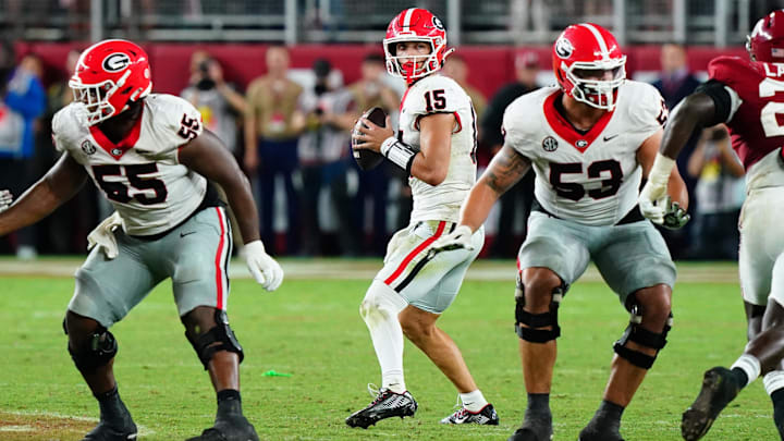 Sep 28, 2024; Tuscaloosa, Alabama, USA; Georgia Bulldogs quarterback Carson Beck (15) drops back to throw against the Alabama Crimson Tide during the fourth quarter at Bryant-Denny Stadium. Mandatory Credit: John David Mercer-Imagn Images Sep 28, 2024; Tuscaloosa, Alabama, USA; Georgia Bulldogs quarterback Carson Beck (15) drops back to throw against the Alabama Crimson Tide during the fourth quarter at Bryant-Denny Stadium. Mandatory Credit: John David Mercer-Imagn Images