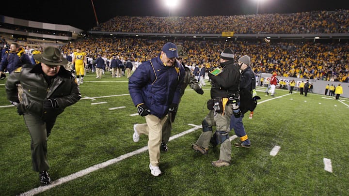 Dec 1, 2007, Morgantown, WV, USA; West Virginia Mountaineer head coach Rich Rodriguez leaves the field after the Mountaineers 13-9 loss to the Pittsburgh Panthers at Mylan Puskar Stadium. Duhart recovered the fumble. Mandatory Credit: Bob Donnan-Imagn Images