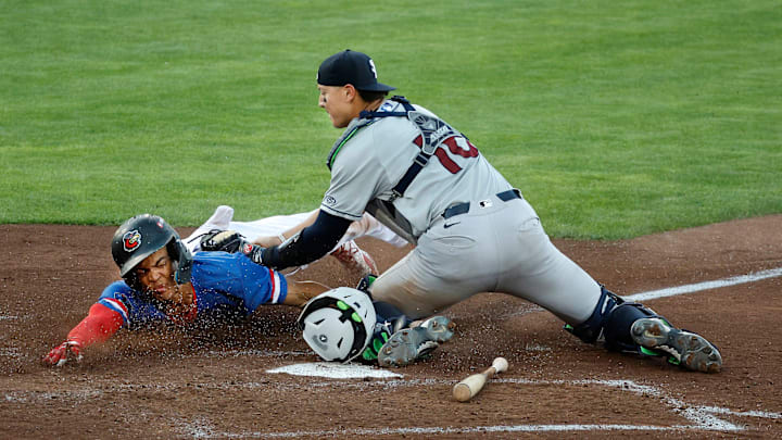 Rochester’s Andrew Pinckney is tagged out trying to score on a squeeze play by Scranton catcher Rafael Flores. Rochester’s Andrew Pinckney is tagged out trying to score on a squeeze play by Scranton catcher Rafael Flores.