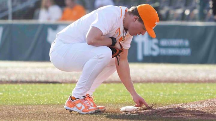 Tennessee pitcher Liam Doyle (12) marks in the dirt at the Tennessee baseball season opener against Hofstra, in Lindsey Nelson Stadium at University of Tennessee in Knoxville, Tenn., Friday, February. 14, 2025.