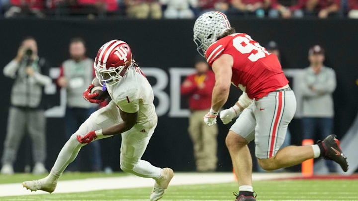Indiana running back Roman Hemby rushes Saturday, Dec. 6, 2025, during the Big Ten football championship against the Ohio State Buckeyes at Lucas Oil Stadium in Indianapolis.
