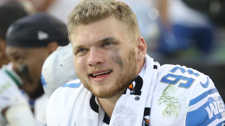 Detroit Lions defensive end Aidan Hutchinson (97) reacts on the sidelines against the Pittsburgh Steelers during the fourth quarter at Acrisure Stadium.