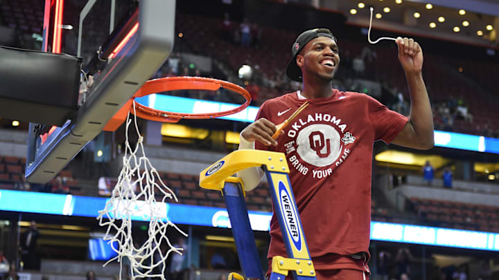 Oklahoma Sooners guard Buddy Hield cuts down the net after a West Regional final in the NCAA Tournament against the Oregon Ducks at the Honda Center.Oklahoma defeated Oregon 80-68. 
