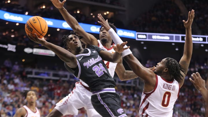 Kansas State junior forward Arthur Kaluma (24) looks for a shot around Iowa State in the first half of the quarterfinal round in the Big 12 Tournament inside the T-Mobile Center in Kansas City, Mo.