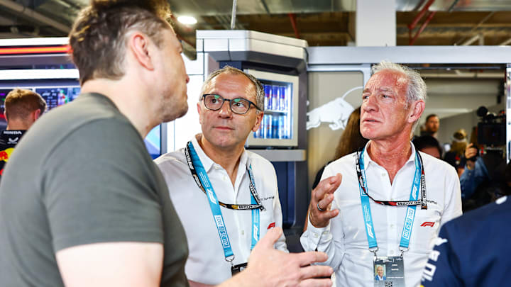 Elon Musk, Stefano Domenicali, CEO of the Formula One Group, and Greg Maffei, CEO of Liberty Media talk in the Red Bull Racing garage during final practice ahead of the F1 Grand Prix of Miami at Miami International Autodrome on May 06, 2023 in Miami, Florida. (Photo by Mark Thompson/Getty Images)