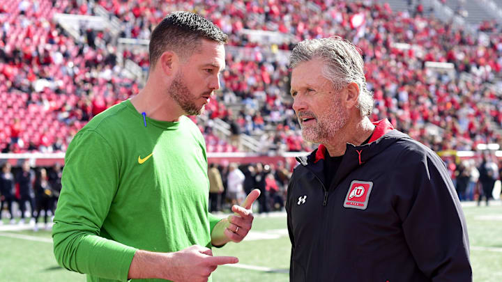 Oct 28, 2023; Salt Lake City, Utah, USA; Oregon Ducks head coach Dan Lanning speaks with Utah Utes head coach Kyle Whittingham before a game at Rice-Eccles Stadium. Mandatory Credit: Christopher Creveling-Imagn Images