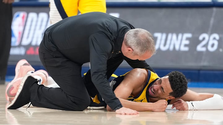 Jun 22, 2025; Oklahoma City, Oklahoma, USA; Indiana Pacers guard Tyrese Haliburton (0) reacts after suffering an injury during the first quarter against the Oklahoma City Thunder during game seven of the 2025 NBA Finals at Paycom Center. Mandatory Credit: Kyle Terada-Imagn Images Jun 22, 2025; Oklahoma City, Oklahoma, USA; Indiana Pacers guard Tyrese Haliburton (0) reacts after suffering an injury during the first quarter against the Oklahoma City Thunder during game seven of the 2025 NBA Finals at Paycom Center. Mandatory Credit: Kyle Terada-Imagn Images