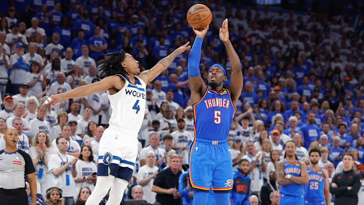 May 28, 2025; Oklahoma City, Oklahoma, USA; Oklahoma City Thunder guard Luguentz Dort (5) shoots as Minnesota Timberwolves guard Rob Dillingham (4) defends in the fourth quarter during game five of the western conference finals for the 2025 NBA Playoffs at Paycom Center. Mandatory Credit: Alonzo Adams-Imagn Images May 28, 2025; Oklahoma City, Oklahoma, USA; Oklahoma City Thunder guard Luguentz Dort (5) shoots as Minnesota Timberwolves guard Rob Dillingham (4) defends in the fourth quarter during game five of the western conference finals for the 2025 NBA Playoffs at Paycom Center. Mandatory Credit: Alonzo Adams-Imagn Images